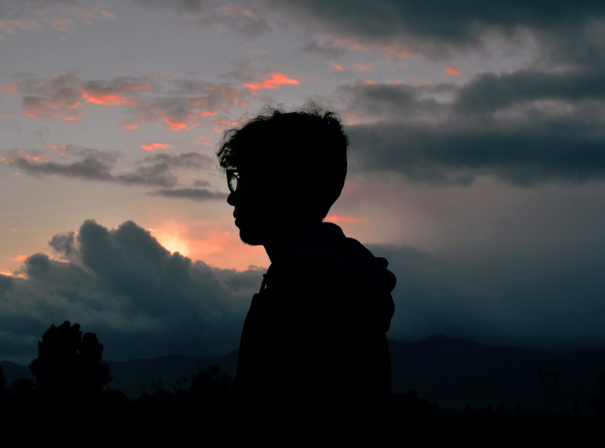 Silhouette of a man with glasses